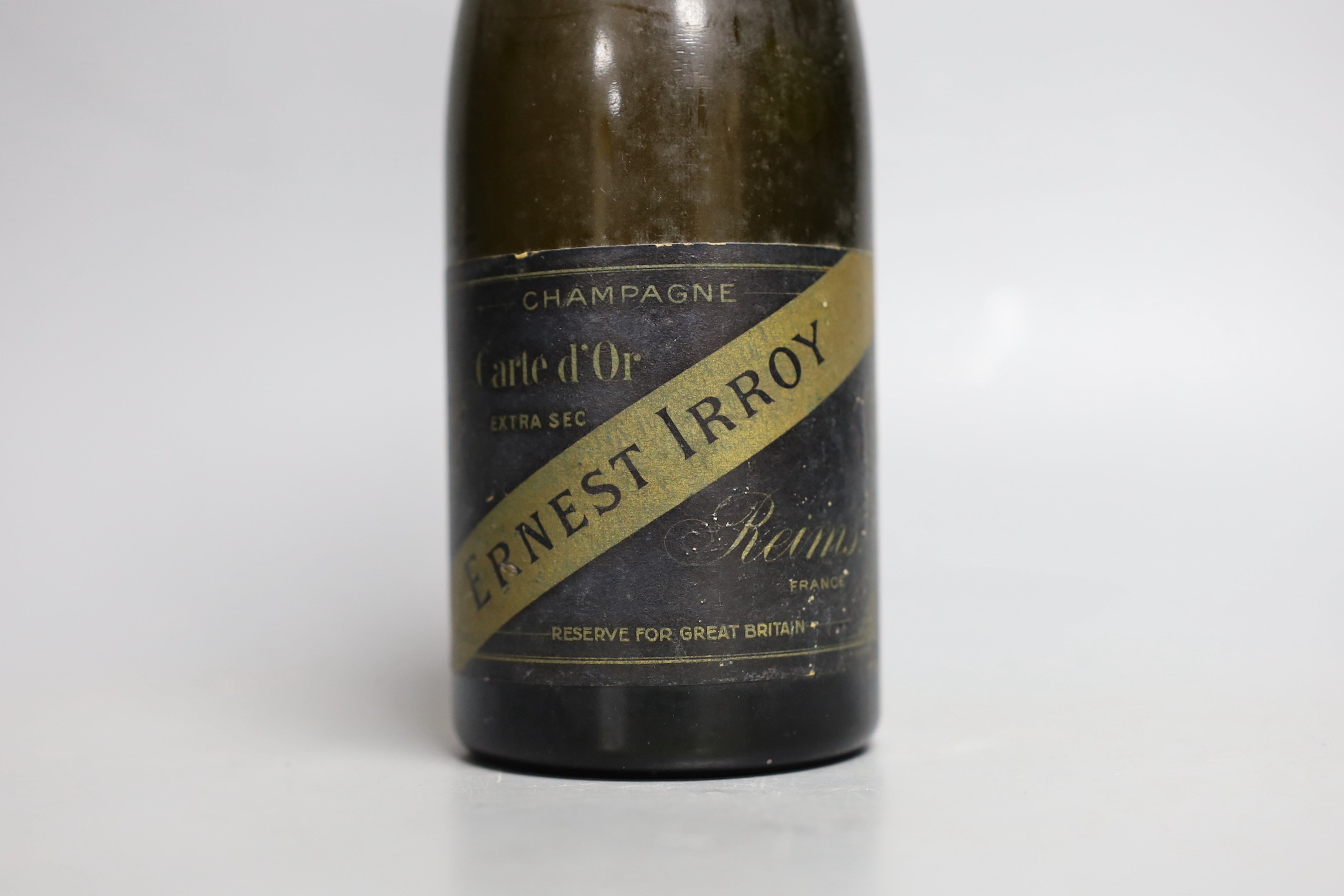 A half bottle of Ernest Irroy champagne with a Union Jack flag